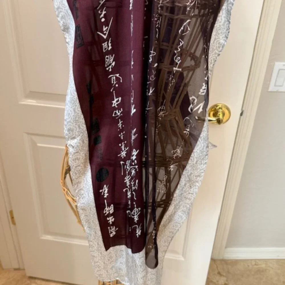 100% silk wine colored and silver oblong scarf.